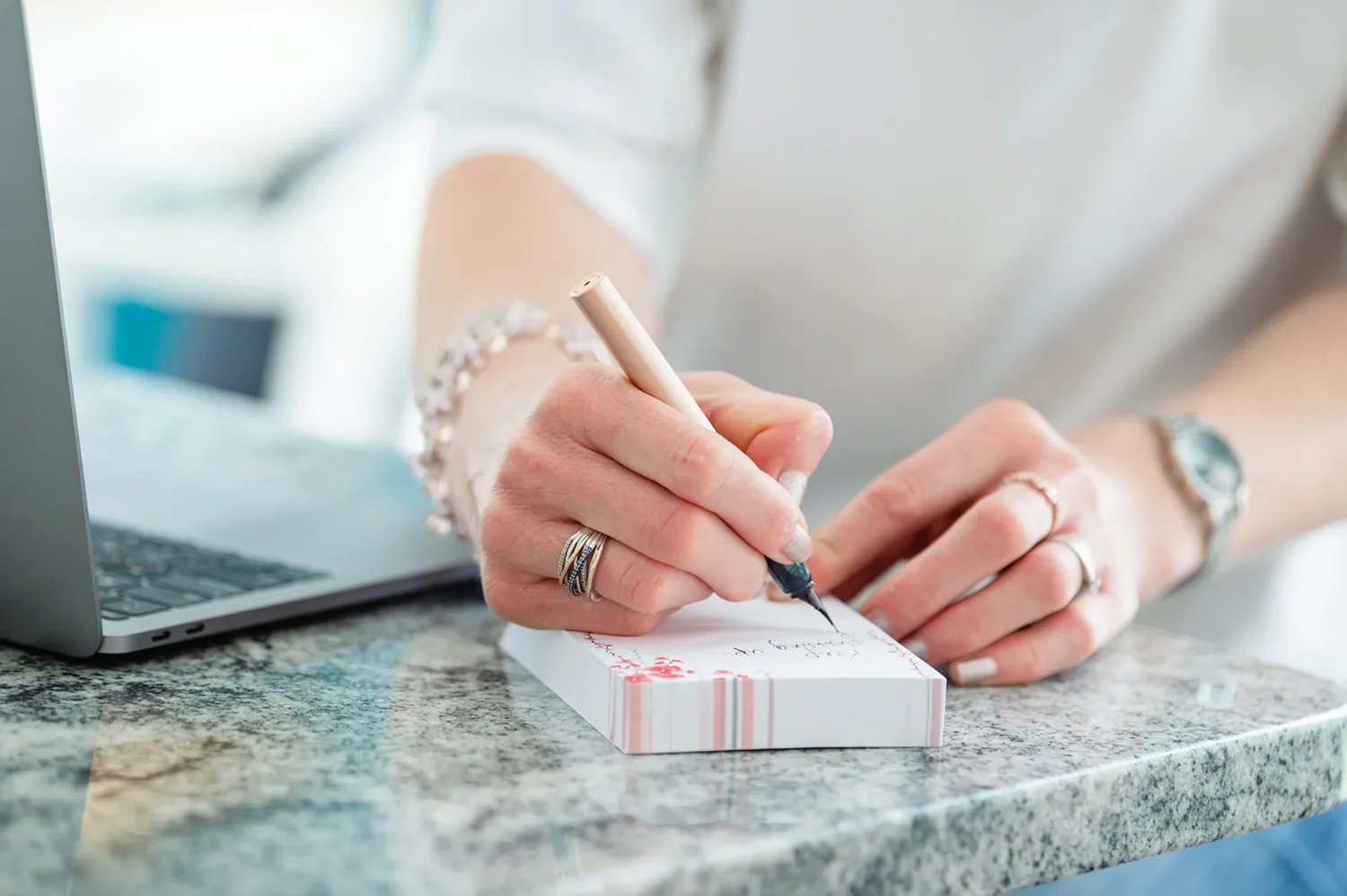 woman hands writing on a piece of paper